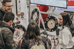 Vasco and Sierra with customers at WOC