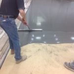 spreading concrete stain