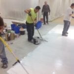 pouring and spreading the overlay