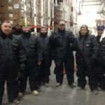 Crew in freezer suits
