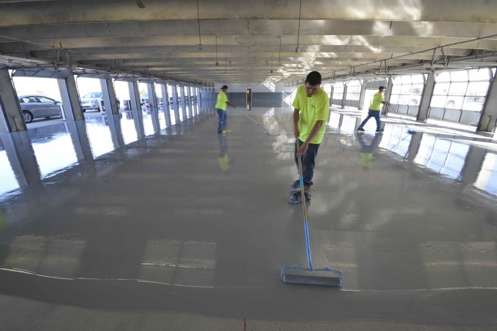 texas-motor-speedway-applying-spartacote-concrete-coatings-garage-areas